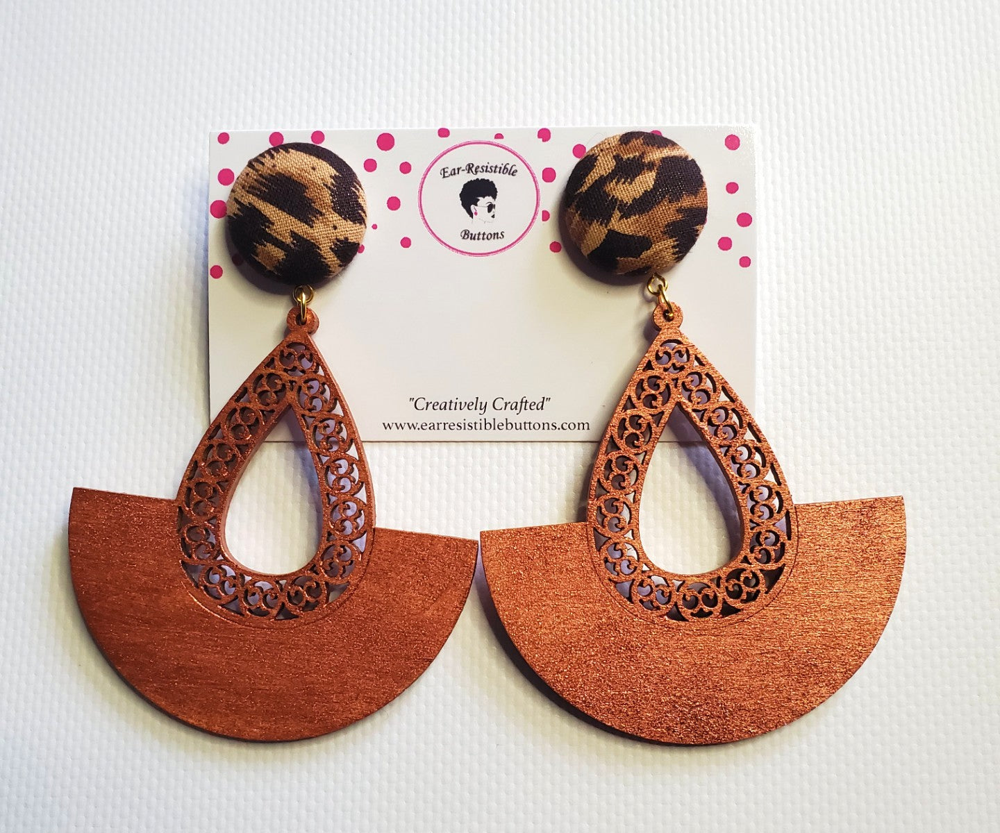 cheetah print button stud earring with attached copper colored wooden accessory